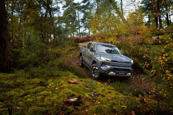 Toyota Hilux BEV driving through a forest
