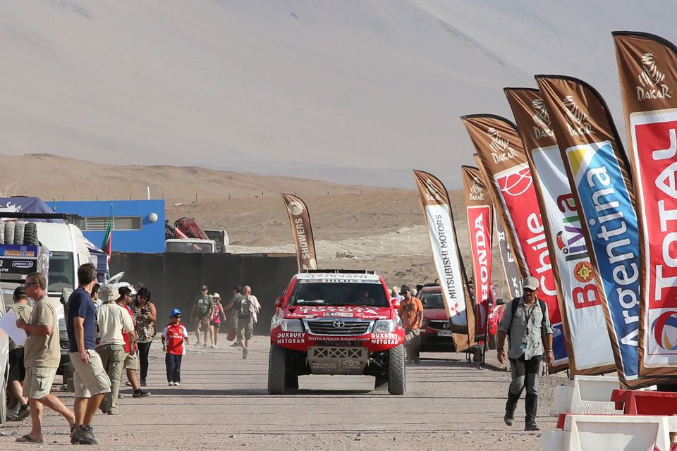 On the brief day of rest, competitors relax and mechanics tend to machines in preparation for the 2nd half of the rally